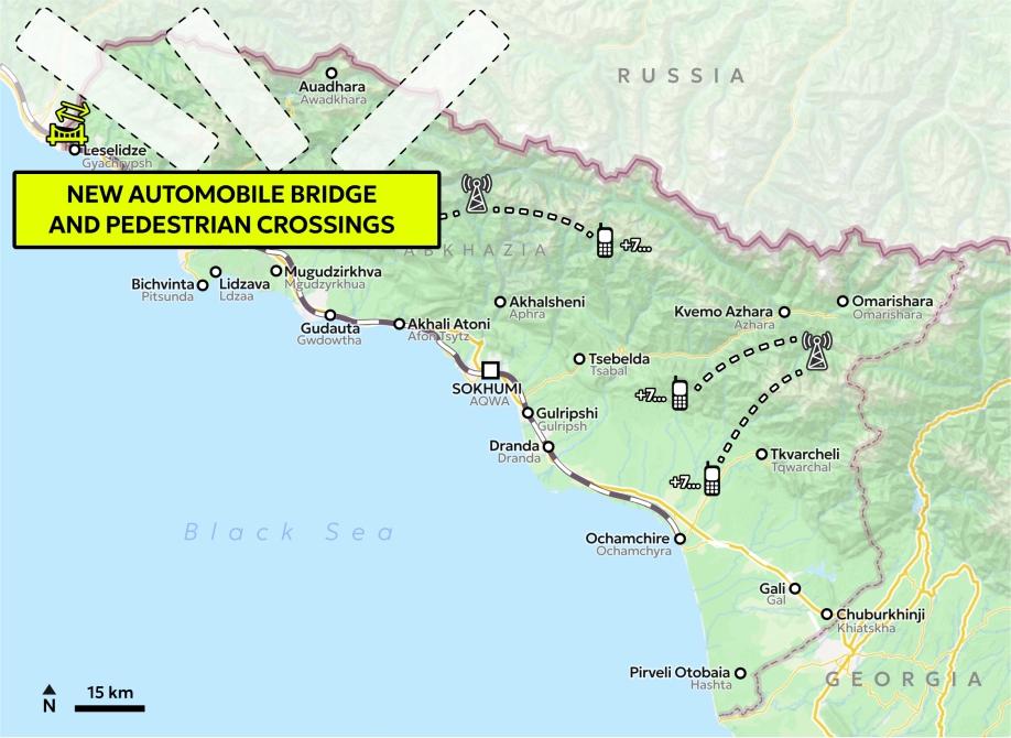 Map of Abkhazia with the indicated bridge icon and three white patches with dashed black outline positioned over the border with Russia, and a yellow text box saying "New automobile bridge and pedestrian crossings".