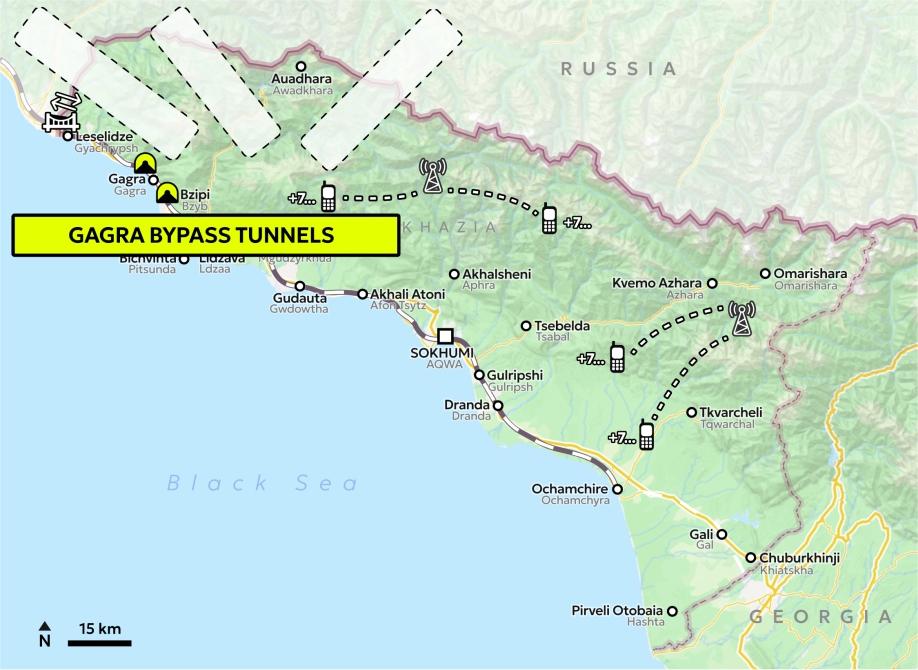 Map of Abkhazia with the tunnel icons and three white patches with dashed black outline positioned over the border with Russia, and a yellow text box saying "Gagra bypass tunnels".